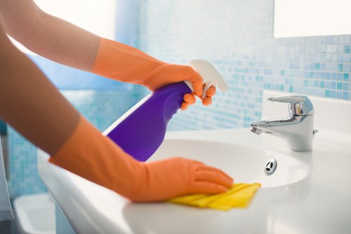 Professional office cleaners maintaining a modern London workspace