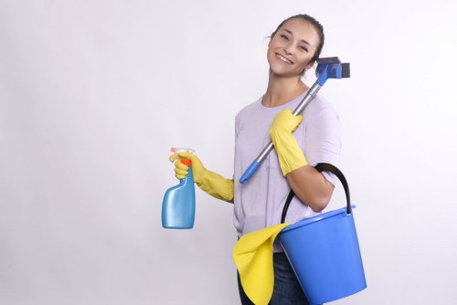 End of tenancy cleaner vacuuming a London flat before inspection