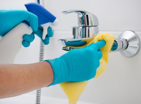 Residential cleaner in London vacuuming a living room